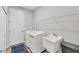 Functional laundry room features a new washer and dryer, utility sink, and storage shelf at 7809 E 114Th Ave, Temple Terrace, FL 33617