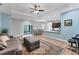 Open-concept living room boasts hardwood floors, recessed lighting, and modern ceiling fan at 7809 E 114Th Ave, Temple Terrace, FL 33617