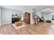 Spacious living area featuring wood floors and comfortable seating arrangements at 7809 E 114Th Ave, Temple Terrace, FL 33617