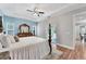 Bright main bedroom with en-suite bathroom and sliding door access to screened in patio at 7809 E 114Th Ave, Temple Terrace, FL 33617