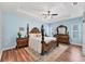 Spacious main bedroom features tray ceiling, ceiling fan, and en-suite bathroom at 7809 E 114Th Ave, Temple Terrace, FL 33617