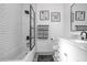 Bright bathroom with a tiled shower-tub, modern fixtures, and stylish vanity with marble countertop at 851 3Rd Ave N, St Petersburg, FL 33701