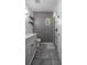 Modern bathroom featuring gray tile accent wall, a shower, and marble countertop vanity at 851 3Rd Ave N, St Petersburg, FL 33701