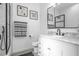 Modern bathroom with a tiled shower-tub, modern fixtures, and stylish vanity with marble countertop at 851 3Rd Ave N, St Petersburg, FL 33701