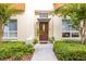 Welcoming home featuring a well-maintained front exterior, complemented by lush greenery and mature trees at 851 3Rd Ave N, St Petersburg, FL 33701