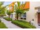 Beautiful exterior elevation of a townhome with manicured landscaping, providing a welcoming curb appeal at 851 3Rd Ave N, St Petersburg, FL 33701