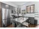 Stylish kitchen featuring modern gray cabinets, stainless steel appliances, and a functional center island at 851 3Rd Ave N, St Petersburg, FL 33701