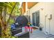 Back patio with outdoor furniture, grey deck, privacy fence and lush plants at 851 3Rd Ave N, St Petersburg, FL 33701