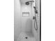 Tiled shower with a modern shower head and a built in soap nook at 851 3Rd Ave N, St Petersburg, FL 33701