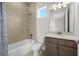 Bathroom featuring a tub and shower combination and a vanity with a sink at 8612 Ivy Stark Blvd, Wesley Chapel, FL 33545