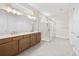 Spacious bathroom boasting a glass-enclosed shower, dual sinks and modern fixtures at 8612 Ivy Stark Blvd, Wesley Chapel, FL 33545