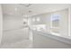 Bright loft area with neutral carpet, recessed lighting, and windows offering natural light at 8612 Ivy Stark Blvd, Wesley Chapel, FL 33545