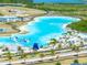 Aerial view featuring the community's expansive pool area with slides and water features at 8749 Drummer Plank Dr, Wesley Chapel, FL 33545