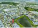 Beautiful aerial view of the community and home showcasing lush landscaping and nearby amenities at 8749 Drummer Plank Dr, Wesley Chapel, FL 33545