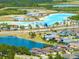 Aerial view of community showing neighborhood, lakes, and recreation areas at 8749 Drummer Plank Dr, Wesley Chapel, FL 33545