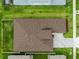 Overhead aerial image of a well-maintained roof and beautiful landscaping at 8749 Drummer Plank Dr, Wesley Chapel, FL 33545
