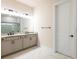A Primary bathroom featuring a double vanity with granite countertops and a walk in shower at 8749 Drummer Plank Dr, Wesley Chapel, FL 33545
