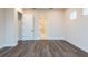 A bedroom with wood floors, a walk in closet and a window with lots of natural light at 8749 Drummer Plank Dr, Wesley Chapel, FL 33545