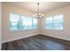 The bright dining room features ample natural light through large windows, creating an inviting atmosphere for meals and gatherings at 8749 Drummer Plank Dr, Wesley Chapel, FL 33545