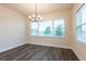 An open dining room with large windows offers natural light and creates a welcoming space for Gathering gatherings at 8749 Drummer Plank Dr, Wesley Chapel, FL 33545