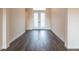 Elegant foyer with hardwood flooring and front double doors provides an inviting entrance at 8749 Drummer Plank Dr, Wesley Chapel, FL 33545