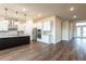 Stylish kitchen featuring a center island, granite countertops, stainless steel appliances, and ample cabinet space at 8749 Drummer Plank Dr, Wesley Chapel, FL 33545