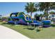 Fun playground area with colorful inflatable and comfortable seating at 8749 Drummer Plank Dr, Wesley Chapel, FL 33545