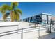 This rooftop lounge area by the pool features private cabanas for relaxing at 8749 Drummer Plank Dr, Wesley Chapel, FL 33545