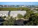 Aerial view of townhomes near a scenic waterfront with city views at 9660 Tara Cay Ct # 38, Seminole, FL 33776