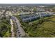 An aerial view of a residential community with tree lined streets and well-maintained landscaping at 9660 Tara Cay Ct # 38, Seminole, FL 33776