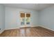 Bright bedroom with wood floors and French doors leading to the outdoors at 9660 Tara Cay Ct # 38, Seminole, FL 33776