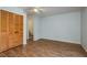 Bedroom featuring wood floors and a spacious closet for ample storage at 9660 Tara Cay Ct # 38, Seminole, FL 33776