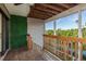 Spacious deck with wooden railing offers serene water views and a peaceful outdoor living space at 9660 Tara Cay Ct # 38, Seminole, FL 33776