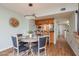 Dining room with a round table, 4 chairs, and a modern lighting fixture at 9660 Tara Cay Ct # 38, Seminole, FL 33776