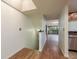View of the entryway featuring wood floors, stairs to the upper level, and entry to the living room at 9660 Tara Cay Ct # 38, Seminole, FL 33776