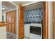 Convenient laundry area with modern washer and dryer, plus storage, tucked behind stylish bi-fold doors at 9660 Tara Cay Ct # 38, Seminole, FL 33776