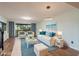 Living room features new furniture, natural light, and hardwood floors at 9660 Tara Cay Ct # 38, Seminole, FL 33776