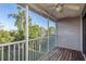 Screened patio view of lush landscaping and blue skies at 9660 Tara Cay Ct # 38, Seminole, FL 33776