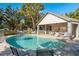 An inviting community pool area with comfortable seating and a covered pavilion at 9660 Tara Cay Ct # 38, Seminole, FL 33776