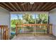 A view of the lake from the screened in porch at 9660 Tara Cay Ct # 38, Seminole, FL 33776