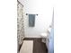 Bathroom features stylish tile floors, a floral shower curtain and modern fixtures at 1006 Harvest Moon Dr, Seffner, FL 33584