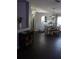 Open concept dining room has decorative shelving, and stylish light fixture at 1006 Harvest Moon Dr, Seffner, FL 33584