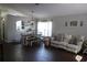 Bright dining area has hardwood floors and is adjacent to the living area at 1006 Harvest Moon Dr, Seffner, FL 33584