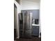 Stainless steel refrigerator next to gray cabinets and white countertops in this bright and modern eat-in kitchen at 1006 Harvest Moon Dr, Seffner, FL 33584