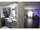 View of kitchen area adjacent to dining and living areas with stainless steel appliances and white quartz countertops at 1006 Harvest Moon Dr, Seffner, FL 33584