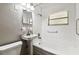 Bathroom featuring a tub with shower, white tile and vintage sink at 10215 N 23Rd St, Tampa, FL 33612