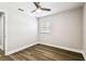 Bedroom featuring a ceiling fan, neutral walls, and new flooring at 10215 N 23Rd St, Tampa, FL 33612