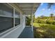 Well-maintained exterior showcasing a covered entryway and manicured landscaping at 10215 N 23Rd St, Tampa, FL 33612