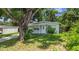 Charming single-story home featuring a well-maintained lawn and inviting curb appeal at 10215 N 23Rd St, Tampa, FL 33612