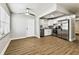 Bright open floor plan showcasing a stainless steel refrigerator and newly renovated kitchen at 10215 N 23Rd St, Tampa, FL 33612